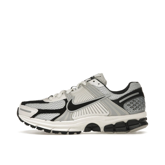 Nike Zoom Vomero 5 Women's sneakers, side view, in photon dust and black.