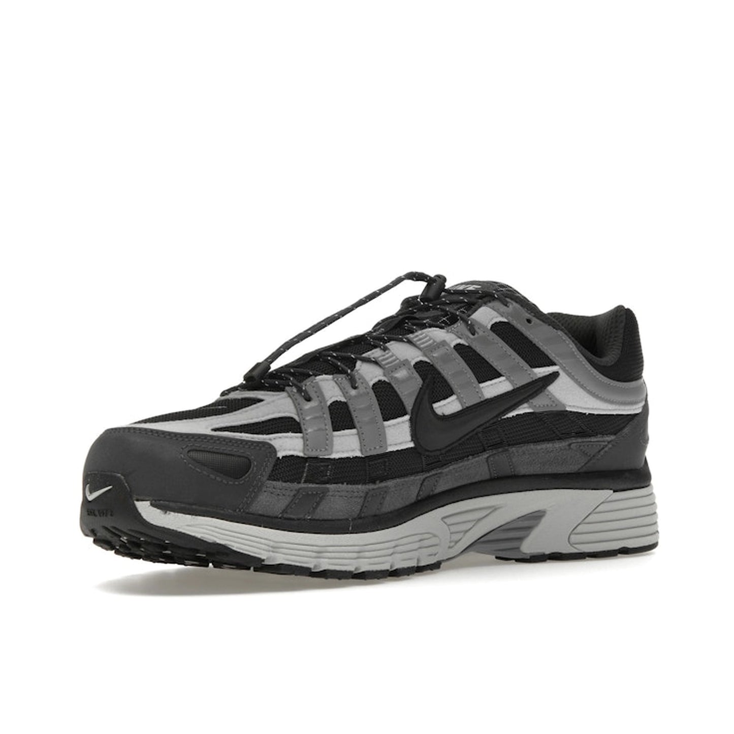 Nike P-6000, front view, in dark anthracite and smoke grey tones.