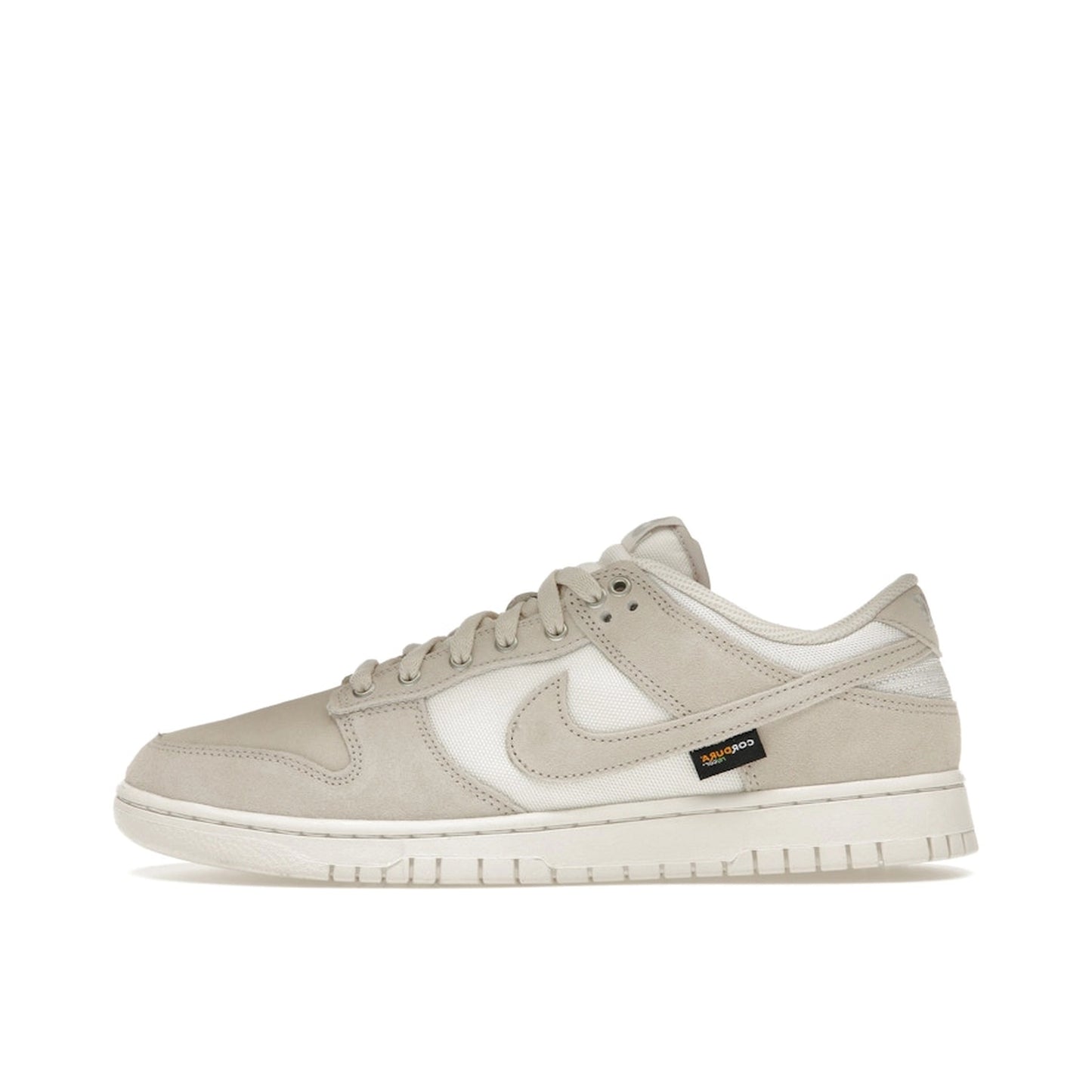 Nike Dunk Low sneakers, side view, in light orewood brown with Cordura fabric construction.
