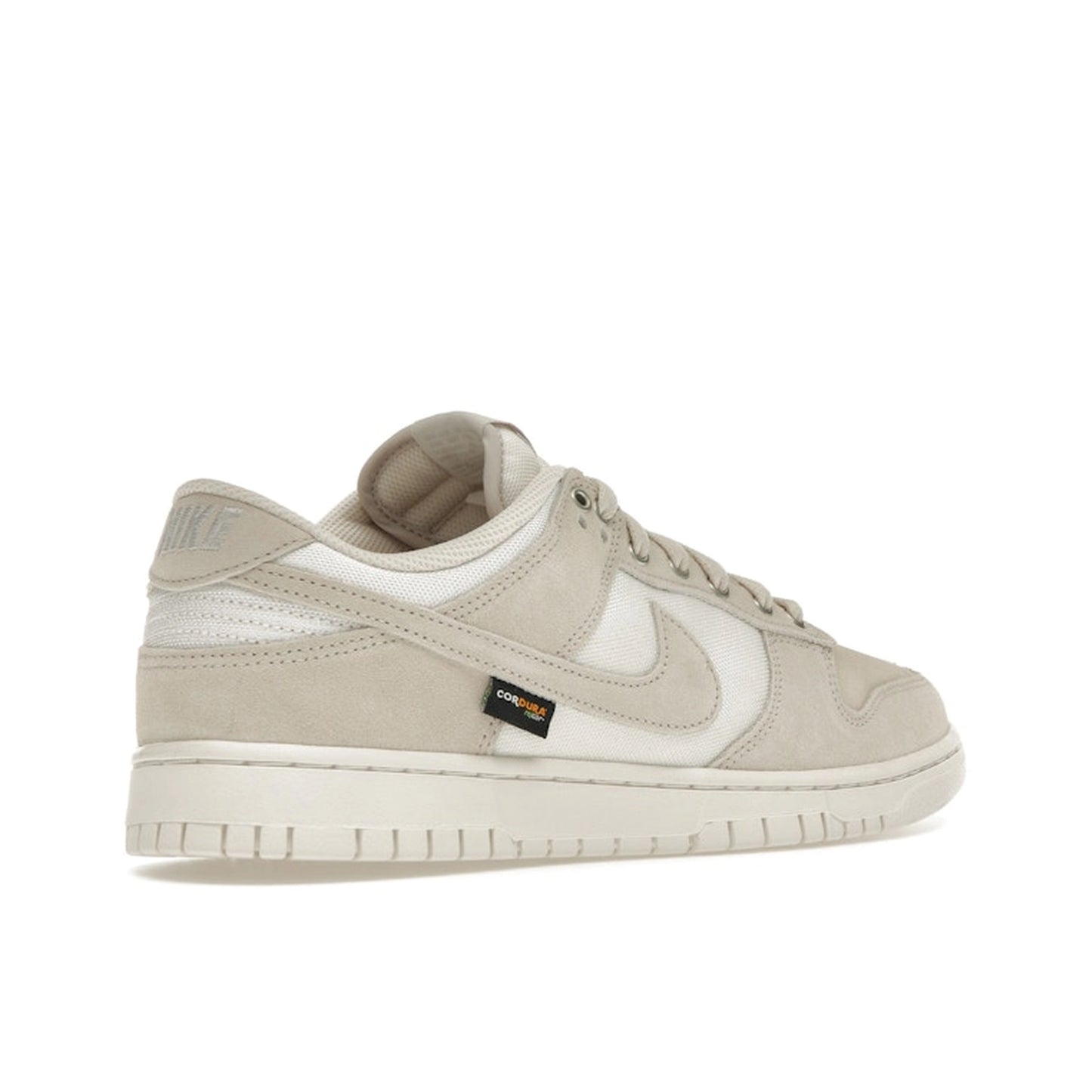Nike Dunk Low sneakers, back view, in light orewood brown with Cordura fabric construction.