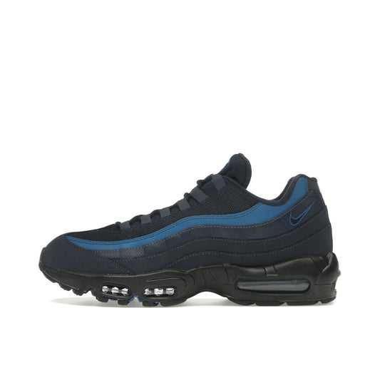 Nike Air Max 95 Thunder Blue, side view, in deep blue mesh with dark grey detailing and Air cushioning.