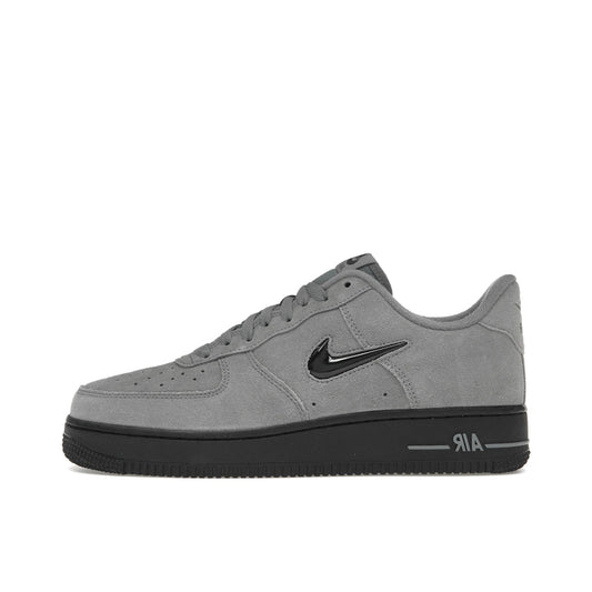 Nike Air Force 1 ’07 Low Jewel sneakers, side view, in cool grey with black swoosh.