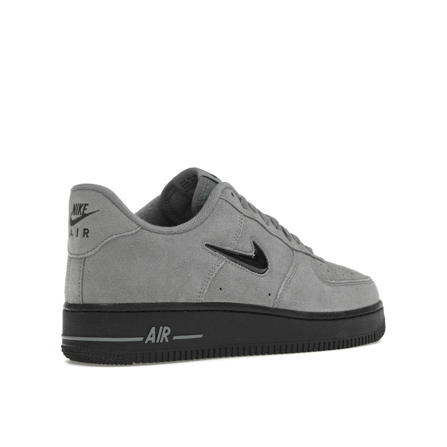 Nike Air Force 1 ’07 Low Jewel sneakers, back view, in cool grey with black swoosh.