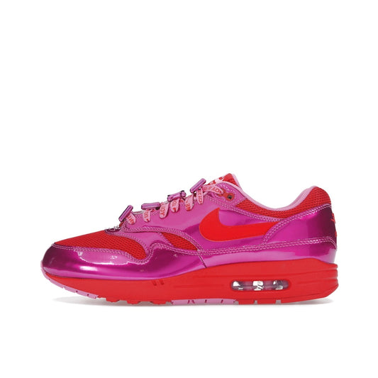 Nike Air Max 1 PRM sneakers, top view, in playful pink with white and heart-inspired accents.