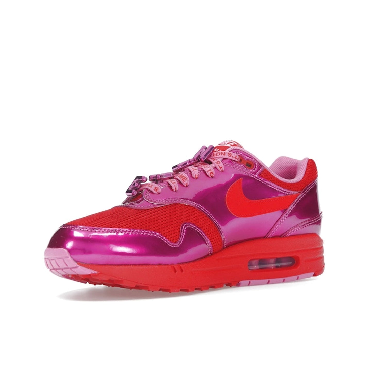 Nike Air Max 1 PRM sneakers, top view, in playful pink with white and heart-inspired accents.