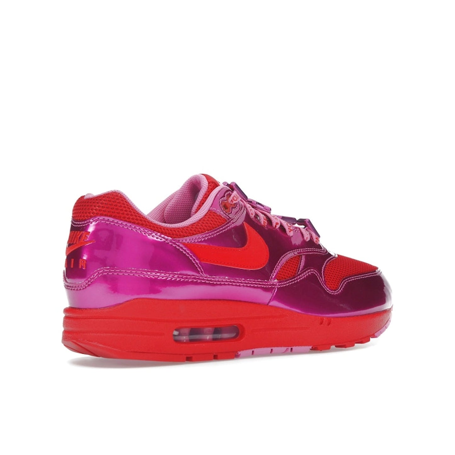 Nike Air Max 1 PRM sneakers, top view, in playful pink with white and heart-inspired accents.