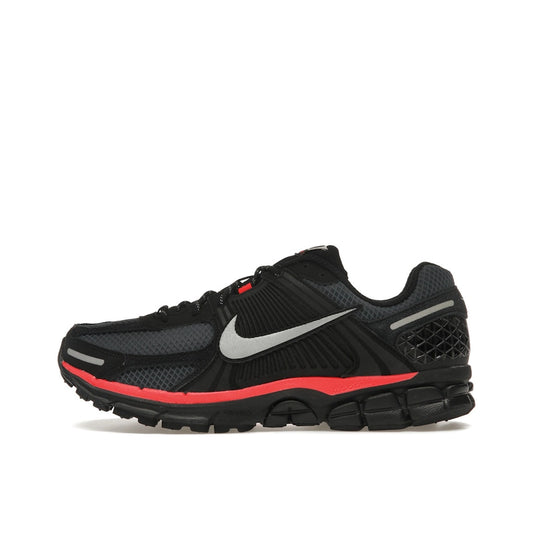 Nike Zoom Vomero 5 Black Metallic Red, side view, mesh and leather in black with red accents.