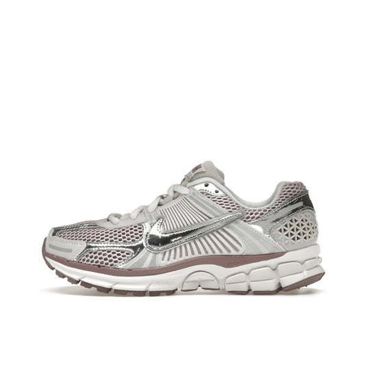 Nike Zoom Vomero 5 Women’s sneakers, side view, in metallic silver with platinum violet accents.