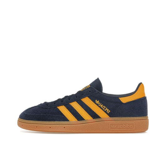 Adidas Handball Spezial sneakers, side view, model IF6565, in night indigo with yellow accents.