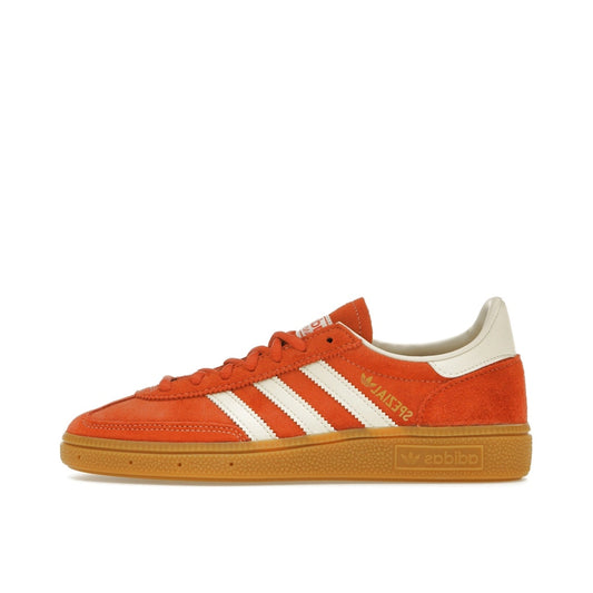 adidas Handball Spezial sneakers, side view, in preloved red with gum sole.