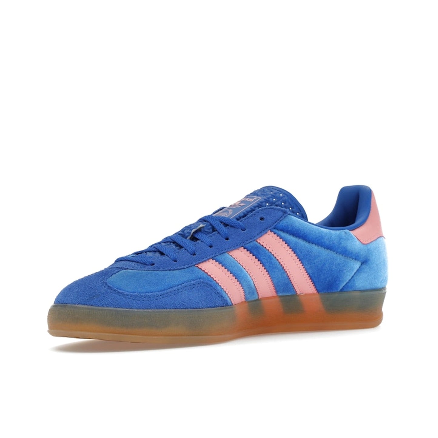 adidas Gazelle Indoor Women’s sneakers, front view, in blue with semi pink spark stripes and gum sole.