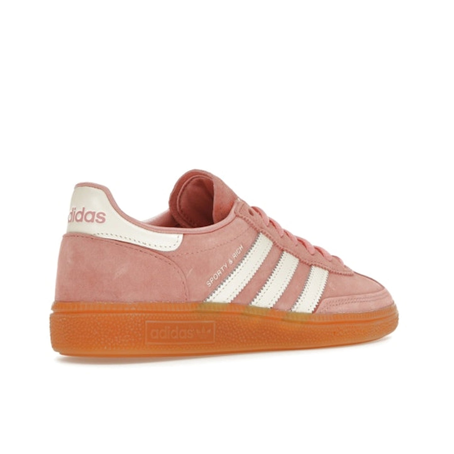 adidas Handball Spezial Sporty & Rich sneakers, back view, in soft pink with white stripes and gum sole.
