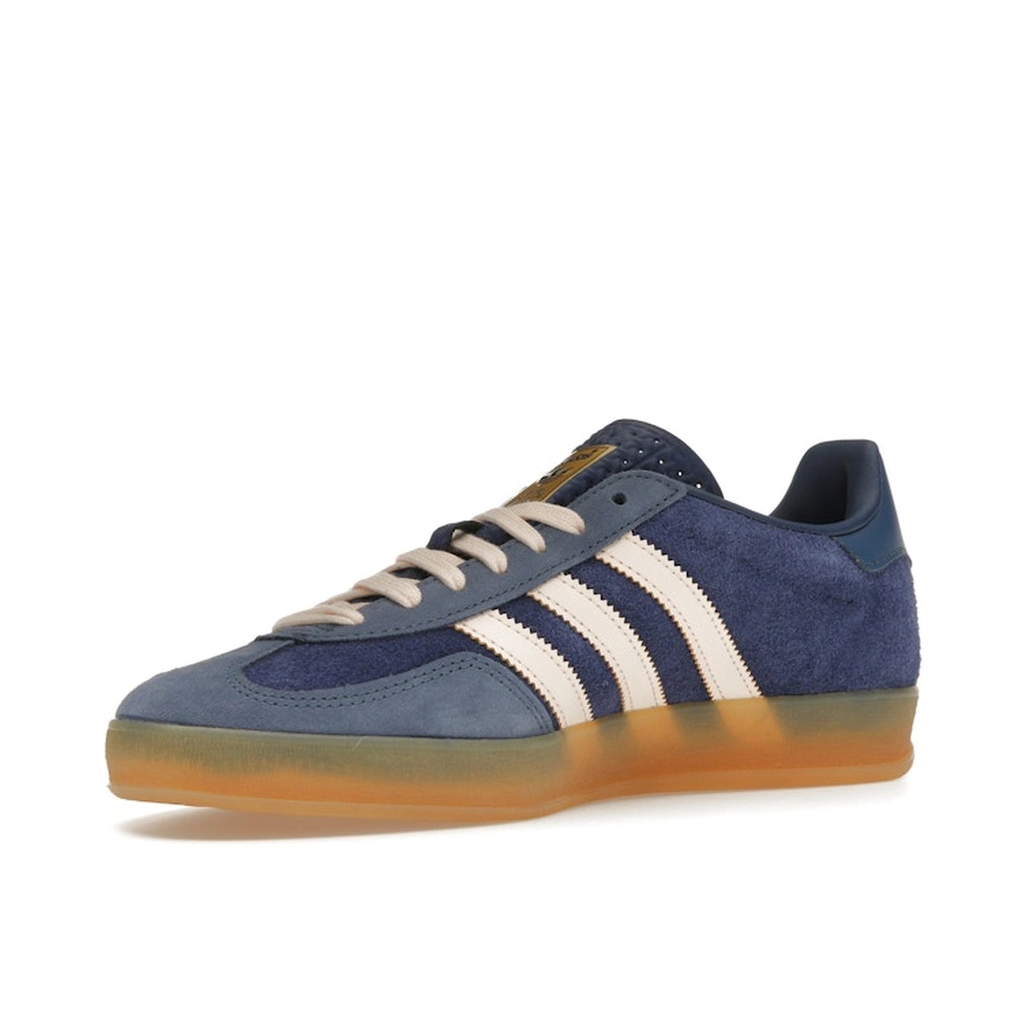 adidas Gazelle Indoor, front view, in dark blue suede with orange accents and retro silhouette.