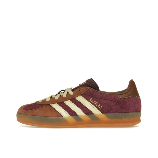Adidas Gazelle Indoor sneakers, side view, model JI0324, in maroon with almost yellow accents.