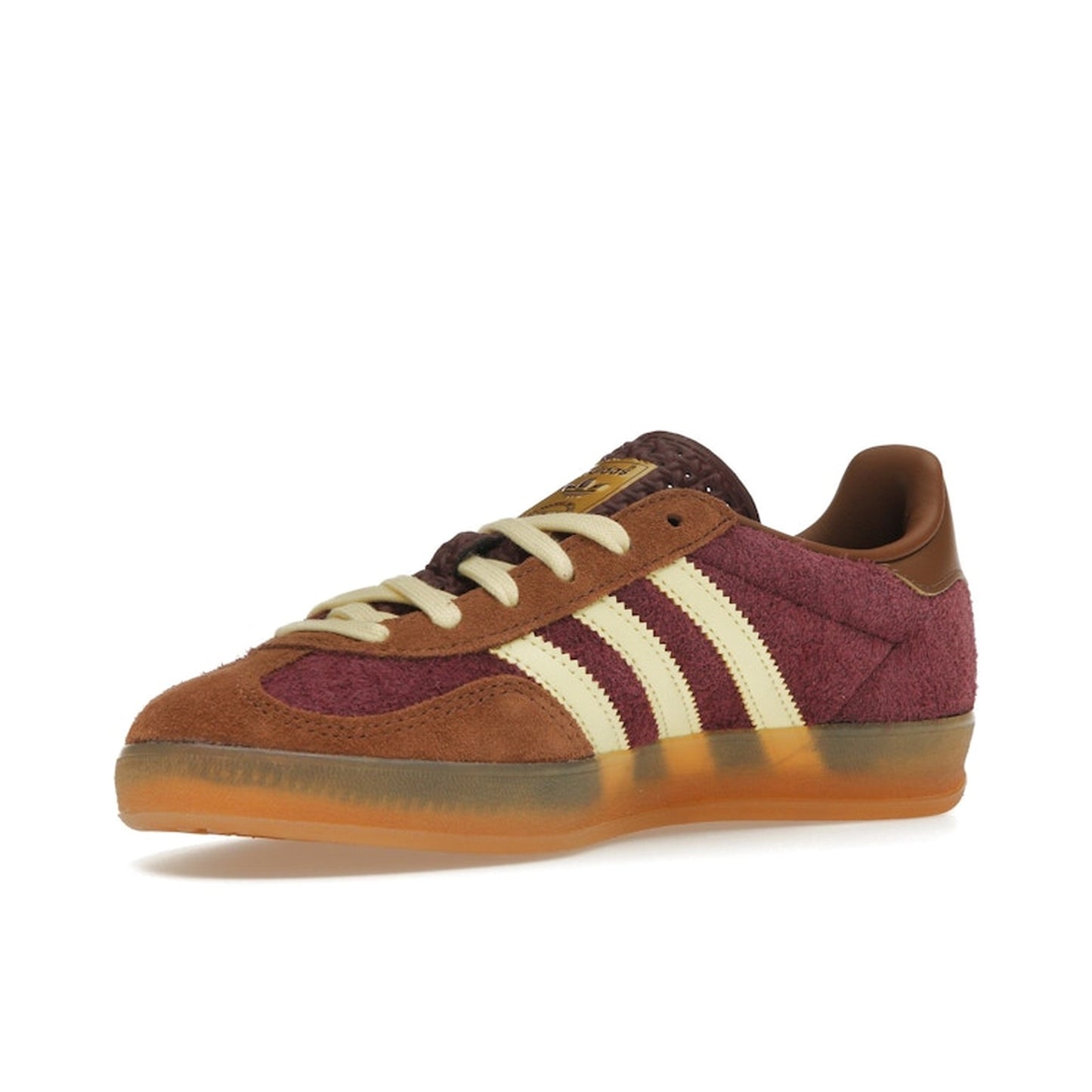 Adidas Gazelle Indoor sneakers, front view, model JI0324, in maroon with almost yellow accents.