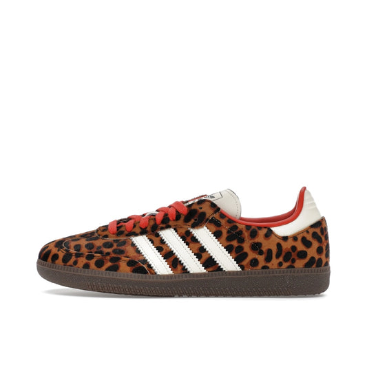 adidas Samba OG, side view, in red suede with leopard-patterned three stripes.