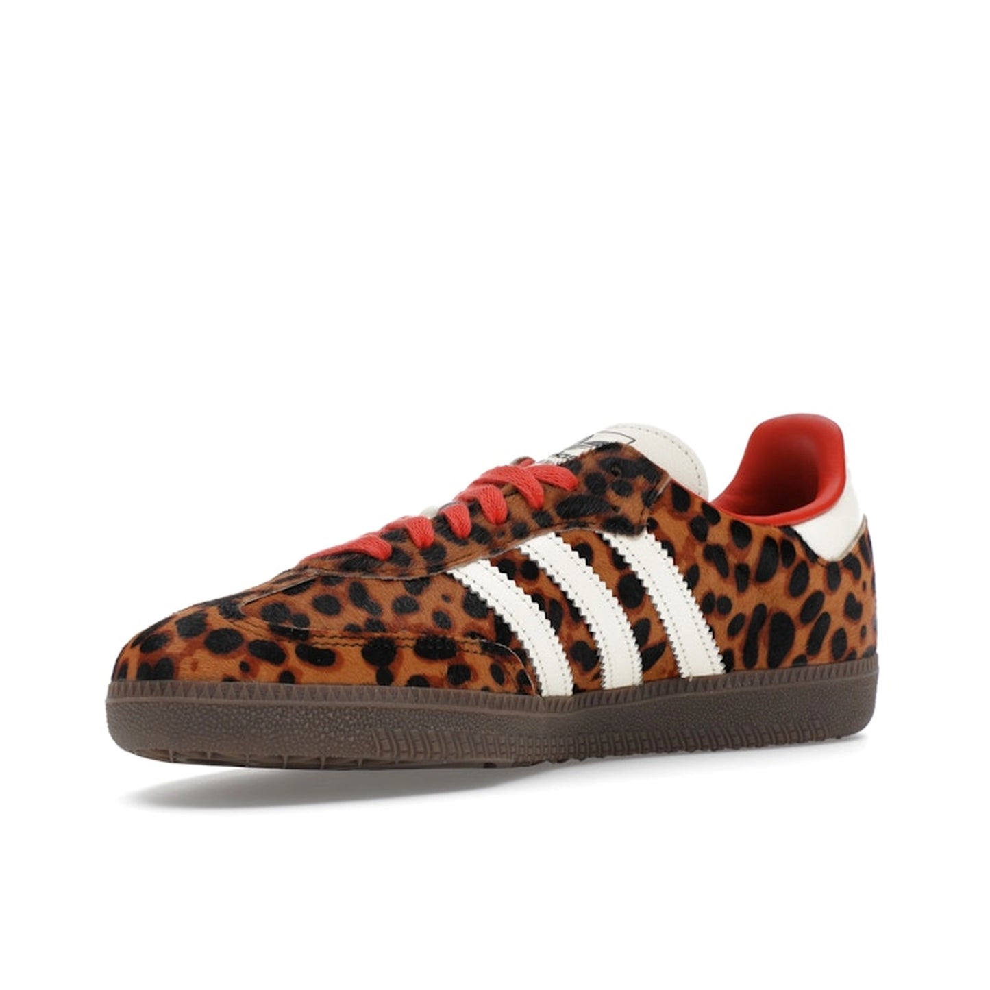 adidas Samba OG, front view, in red suede with leopard-patterned three stripes.