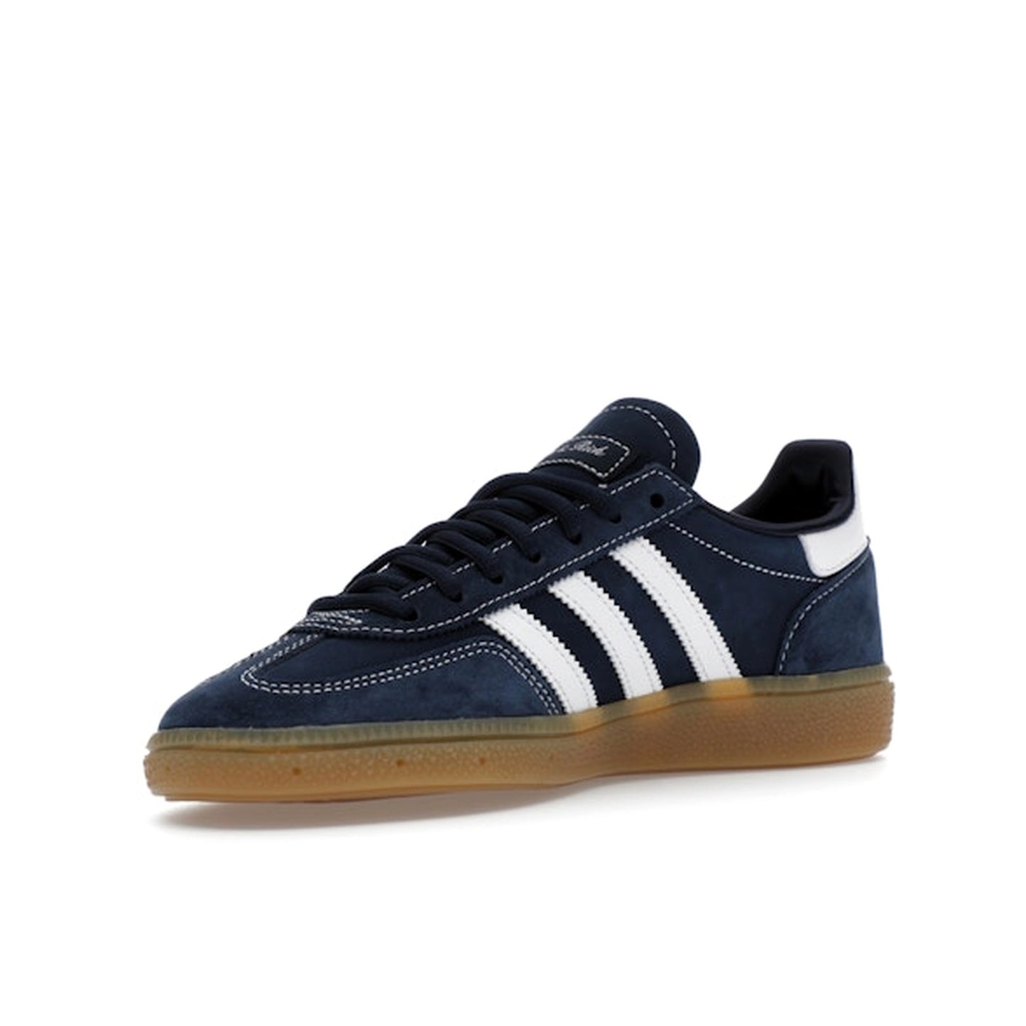 adidas Handball Spezial Sporty & Rich, front view, in deep indigo suede with white three stripes.