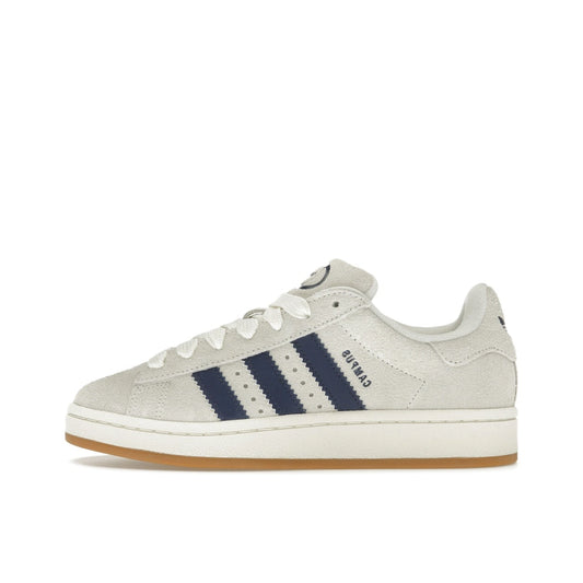 adidas Campus 00s sneakers, side view, in cream white with dark blue three stripes and chunky sole.