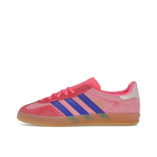 adidas Gazelle Indoor Women’s sneakers, side view, in lucid pink with purple three stripes and gum sole.