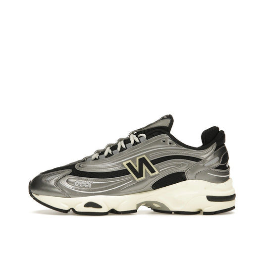 New Balance 1000 sneakers, side view, model M1000SL, silver metallic with grey accents.