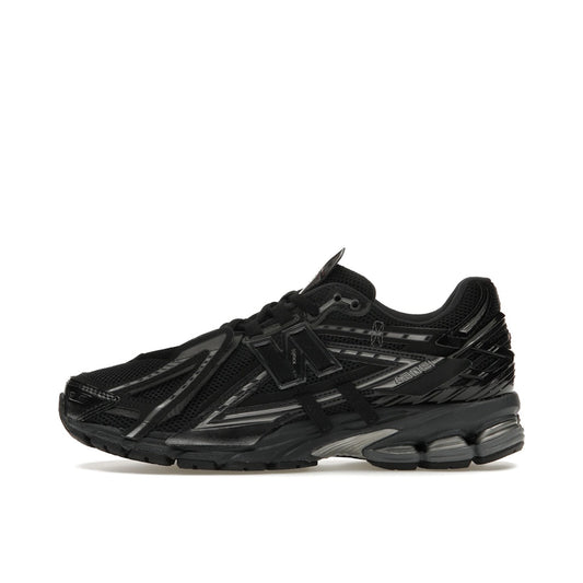 New Balance 1906A Black, side view, in technical mesh with modern runner design.