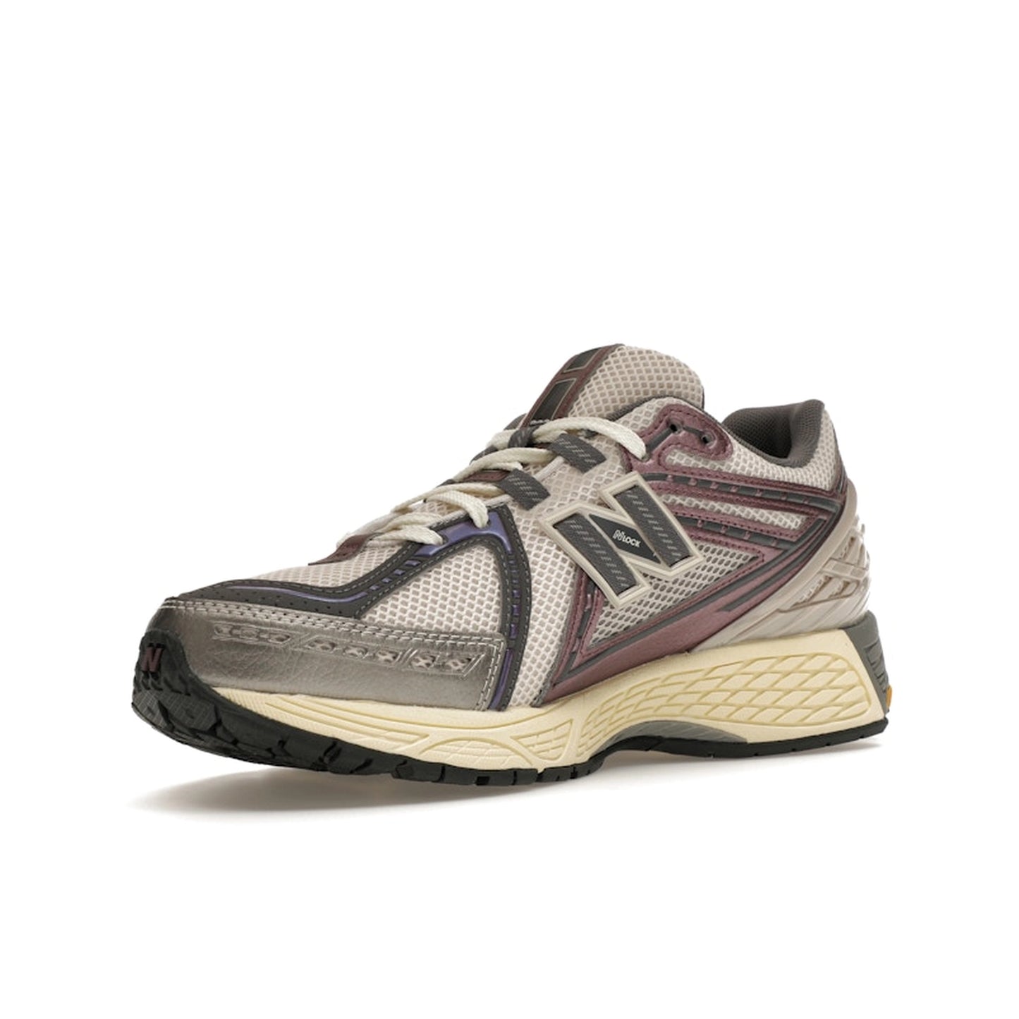 New Balance 1906R Licorice, front view, in rich brown tones with metallic accents and sporty design.