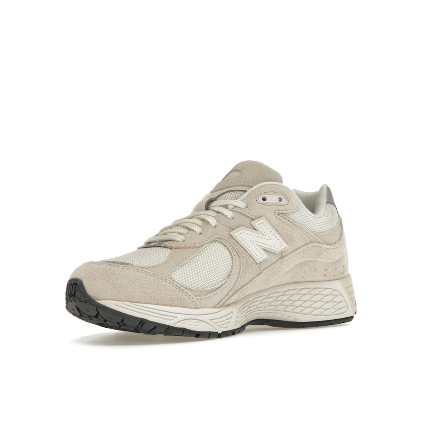 New Balance 2002R sneakers, front view, model M2002RCC, in off-white with subtle detailing.