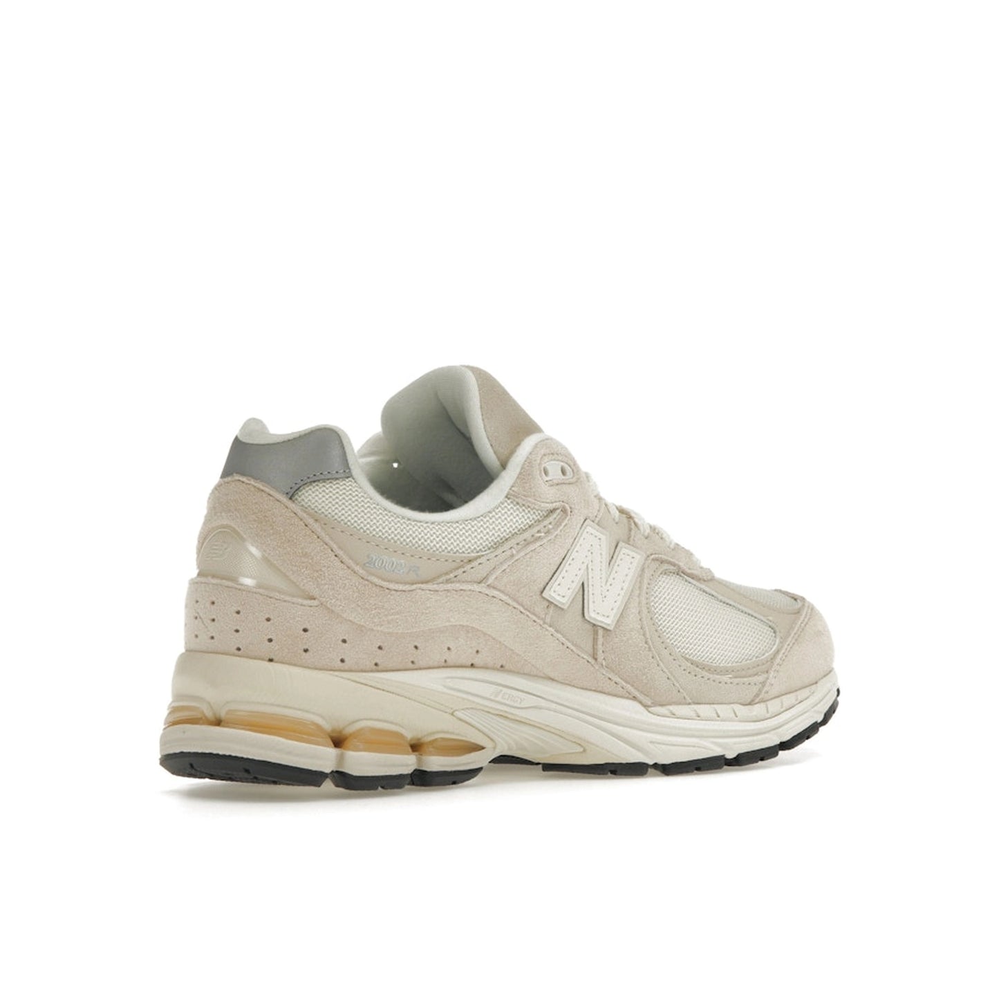 New Balance 2002R sneakers, back view, model M2002RCC, in off-white with subtle detailing.