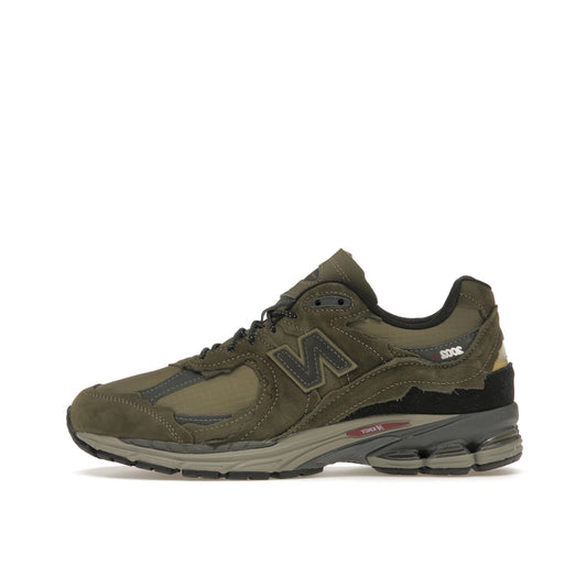 New Balance 2002R Protection Pack sneakers, side view, model M2002RDN in dark moss with grey and black details.