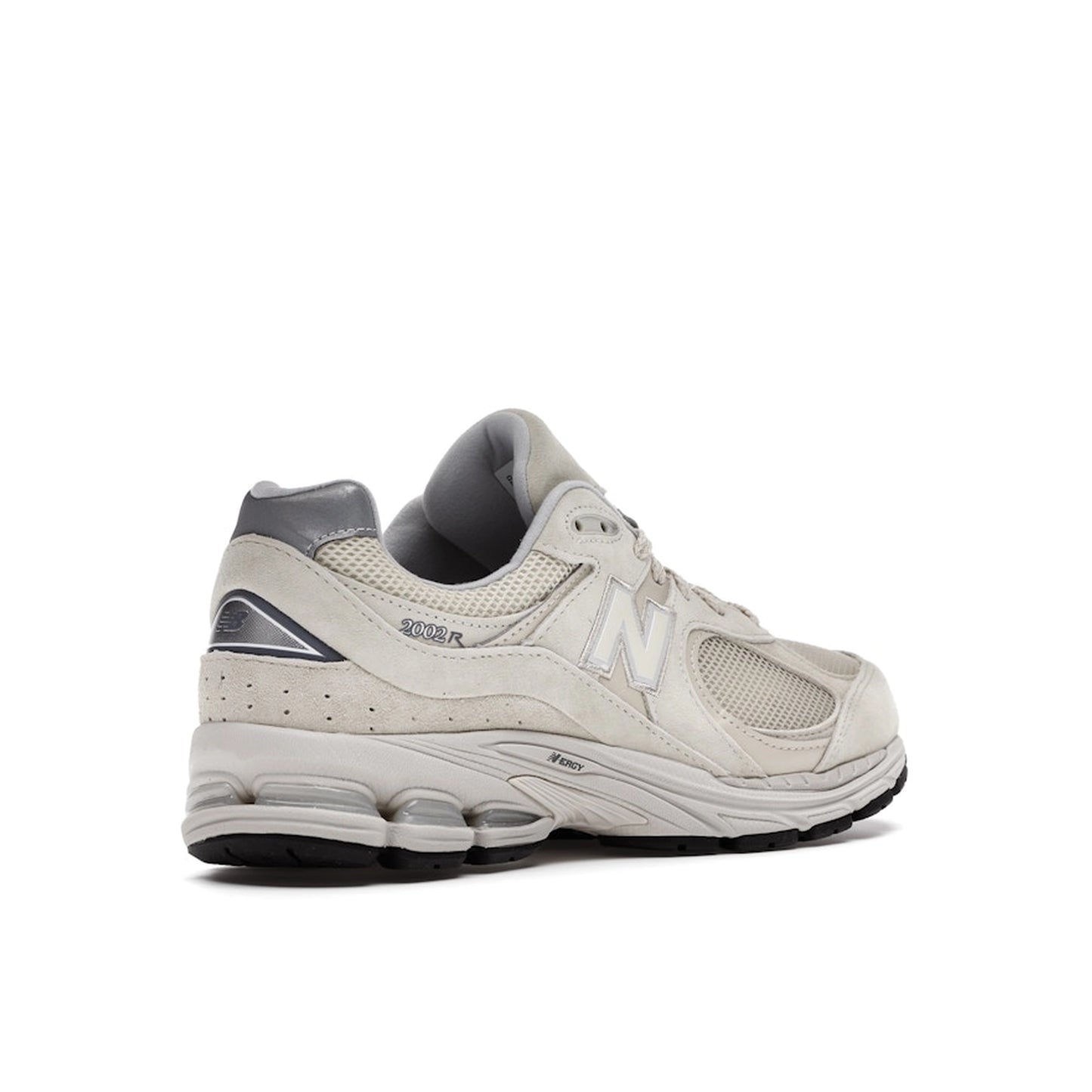 New Balance 2002R sneakers, back view, model ML2002RE, in bone with light aluminum accents.