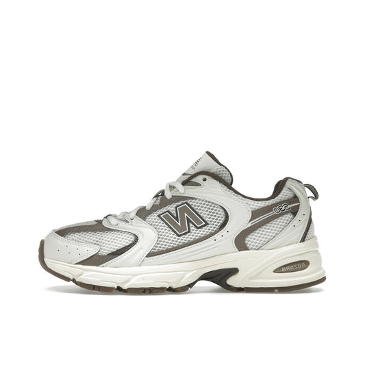 New Balance 530 Turtledove Mushroom, side view, in earthy beige and grey with retro runner profile.
