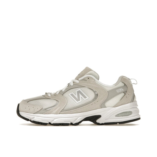 New Balance 530 Sea Salt, side view, in clean white mesh with off-white leather overlays.