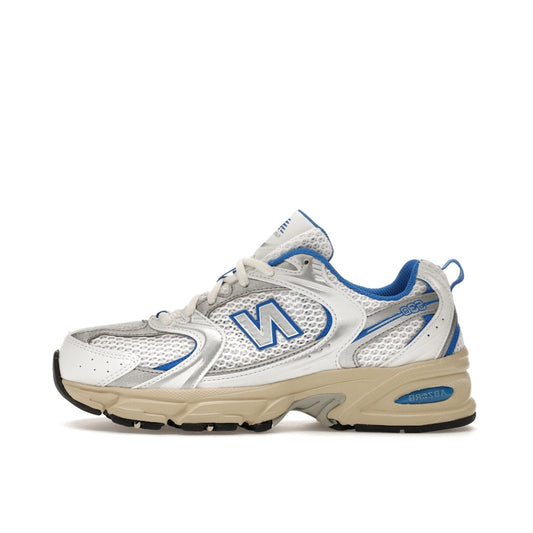 New Balance 530 White Blue Oasis, side view, in white mesh with blue and silver details.