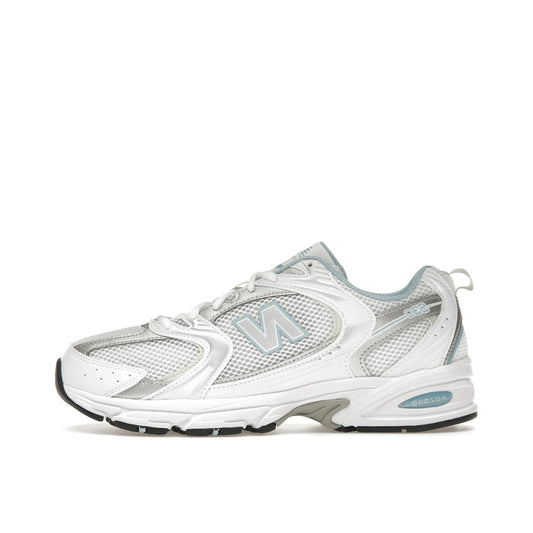 New Balance 530 sneakers, side view, in chrome blue with silver and white accents.