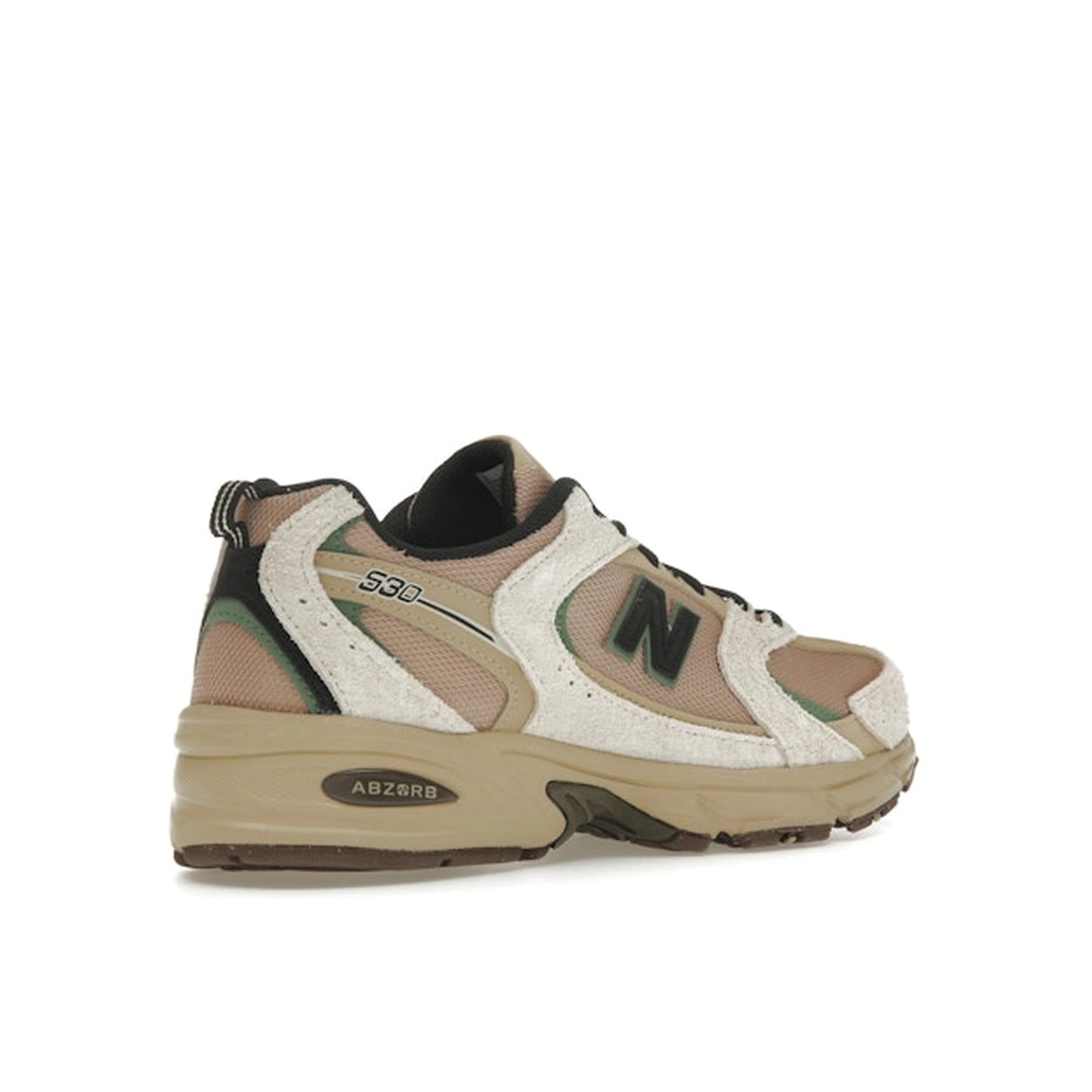 New Balance 530, back view, in linen and incense tones with mesh and suede overlays.