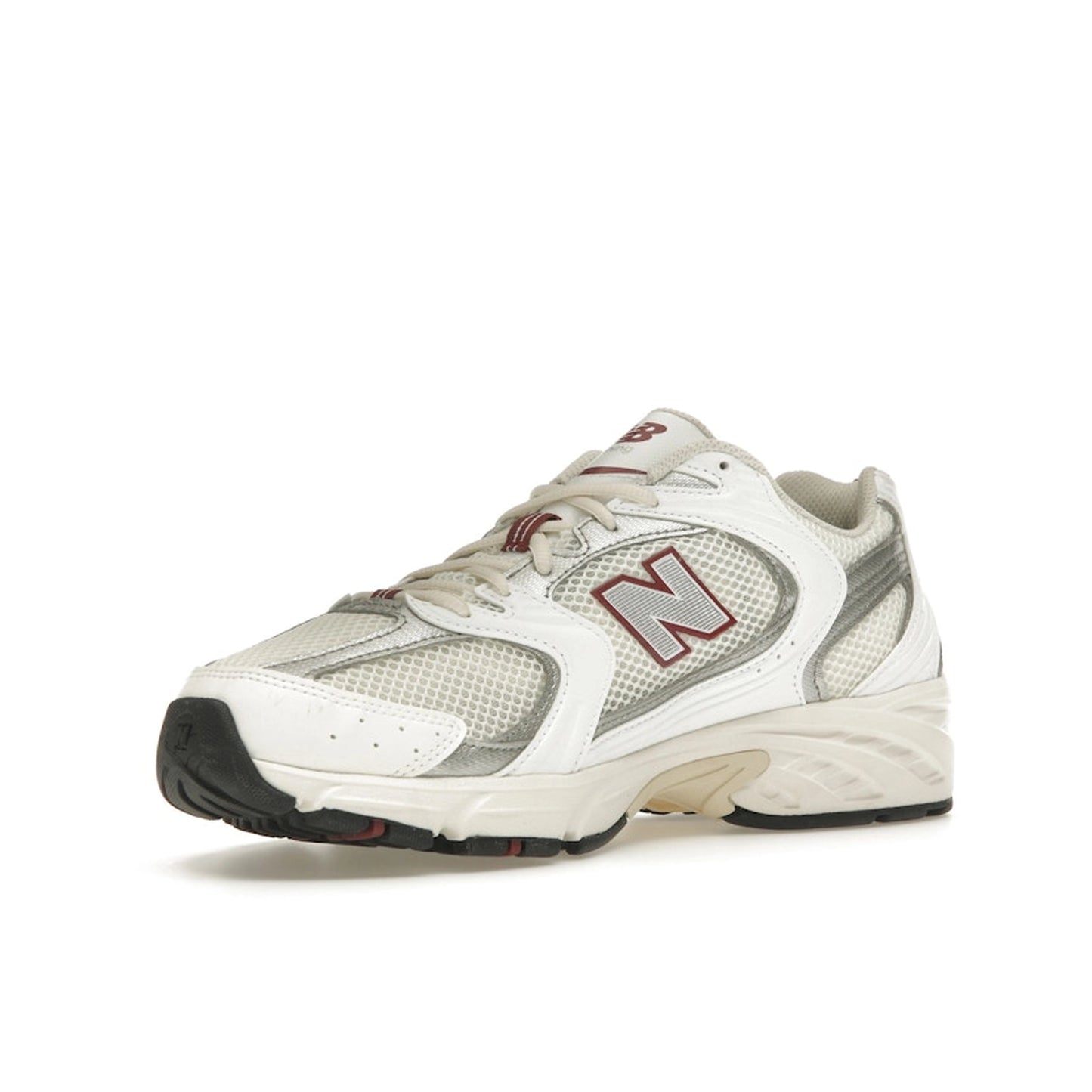 New Balance 530 sneakers, front view, in sea salt with mercury red accents.