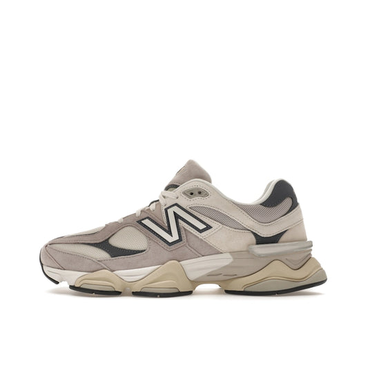 New Balance 9060 sneakers, side view, in moonrock grey with linen beige accents.