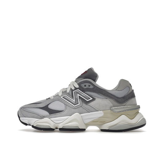 New Balance 9060 sneakers, side view, in rain cloud grey with layered mesh and suede.