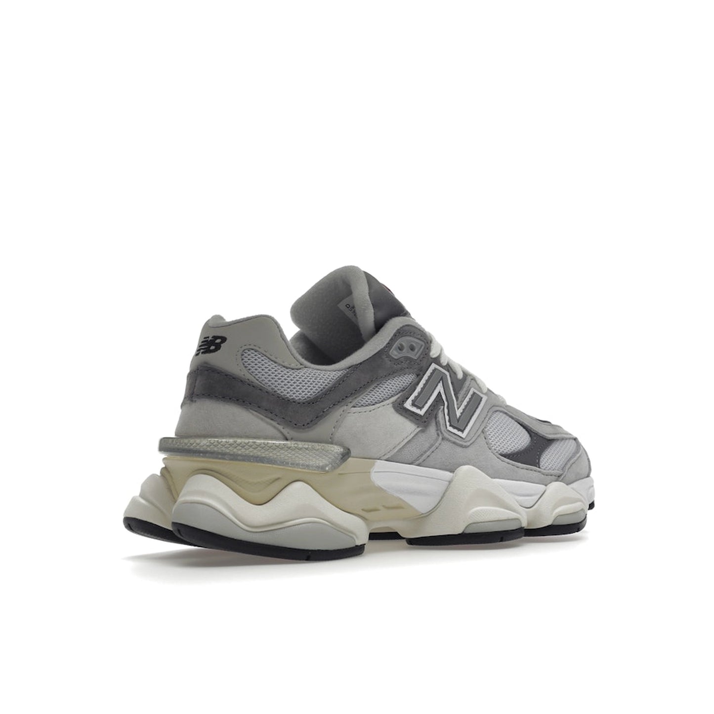 New Balance 9060 sneakers, back view, in rain cloud grey with layered mesh and suede.