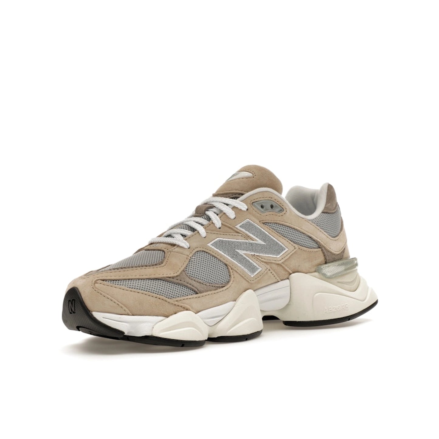 New Balance 9060, front view, in beige and grey with layered suede and mesh upper.