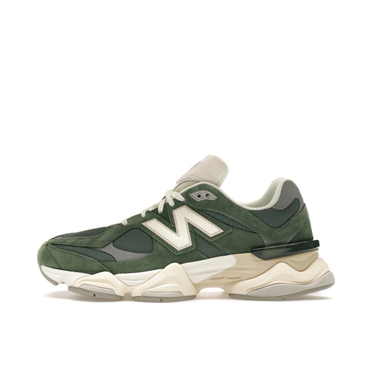 New Balance 9060 Nori, side view, in olive green with a mix of suede and mesh materials.