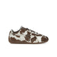 PUMA Speedcat OG Cow Print women's sneaker in chocolate brown leather with gum sole