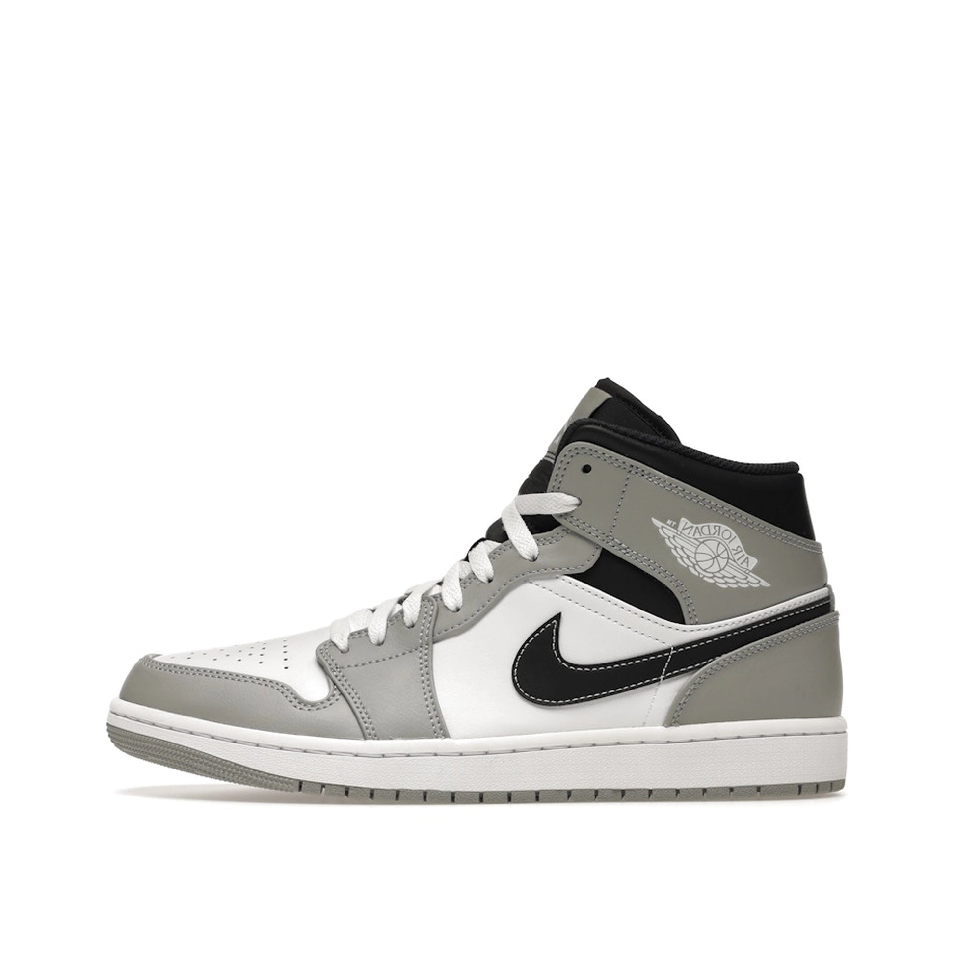 Jordan 1 Mid sneakers, side view, model 554724-078 in smoke grey with anthracite details.