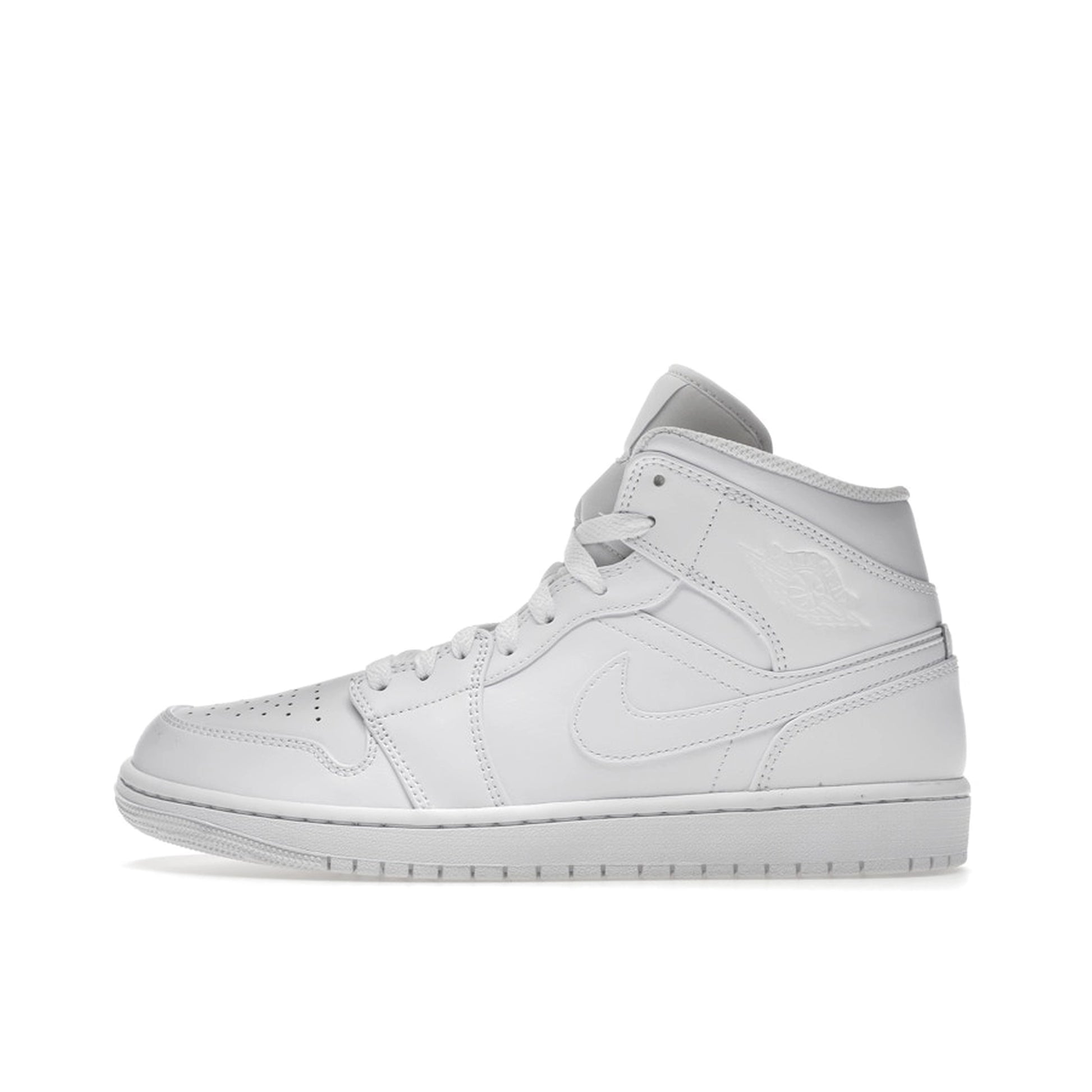 Air Jordan 1 Mid, side view, classic silhouette in full triple white colorway.