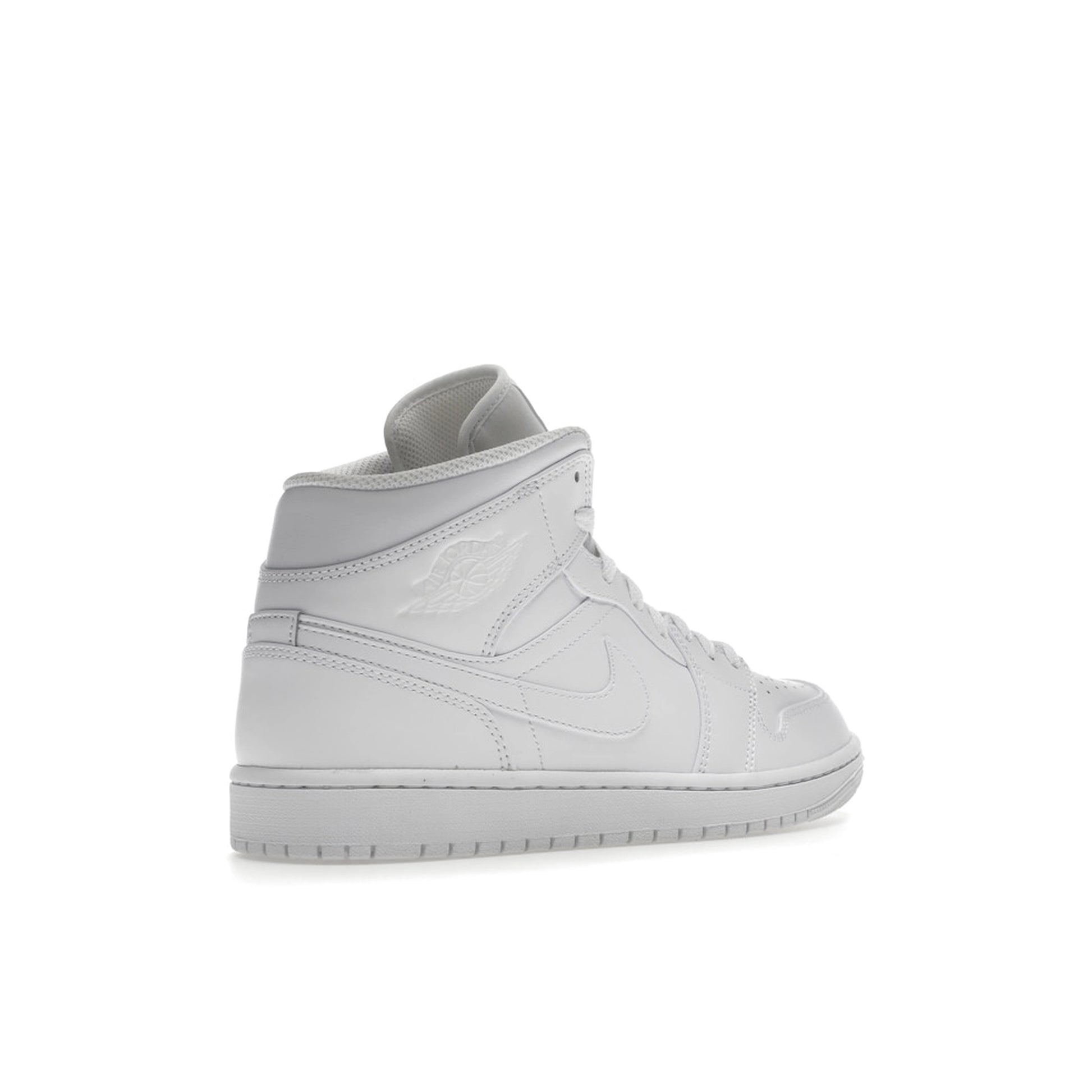 Air Jordan 1 Mid, back view, classic silhouette in full triple white colorway.