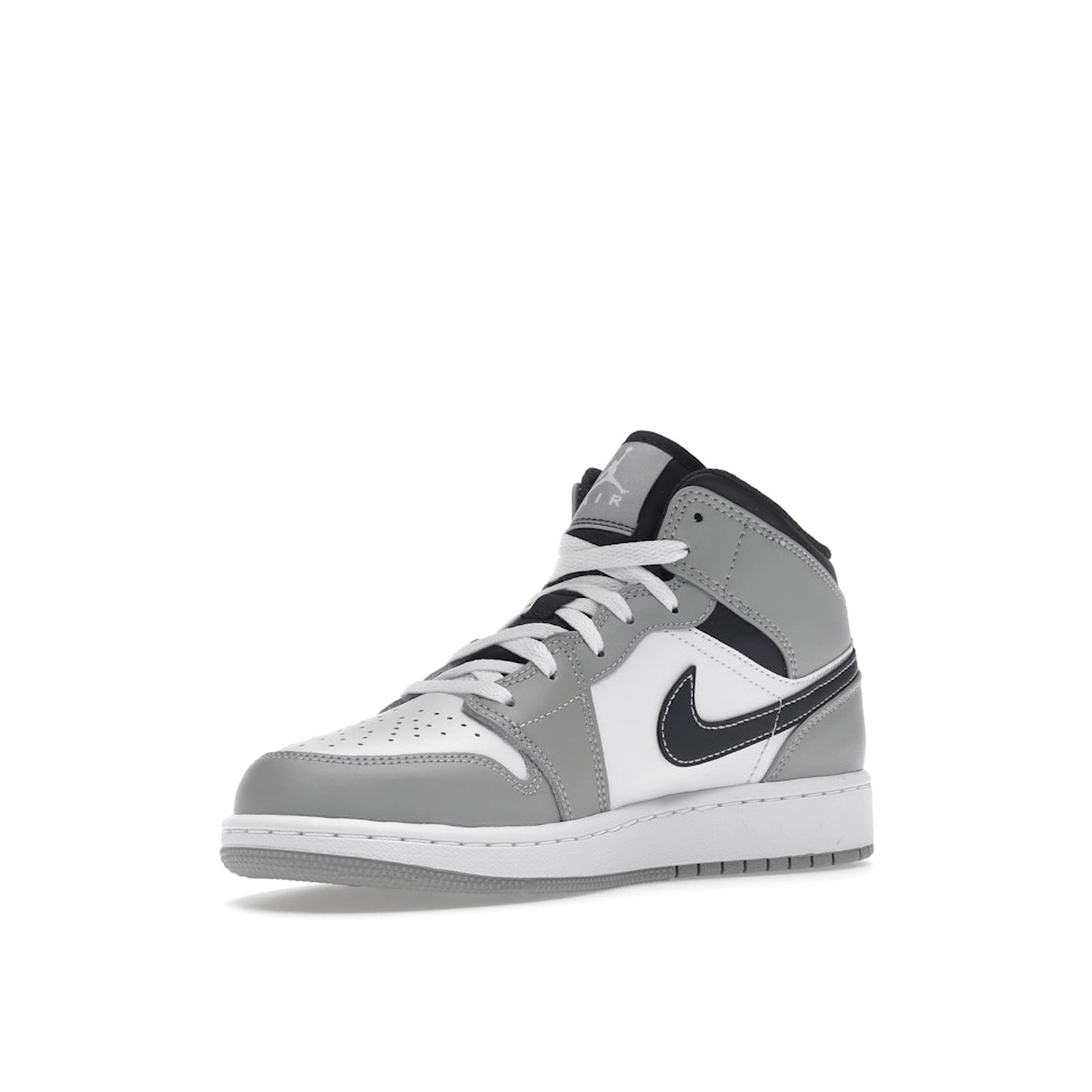 Jordan 1 Mid sneakers (GS), front view, model 554725-078, in light smoke grey with black and white accents.