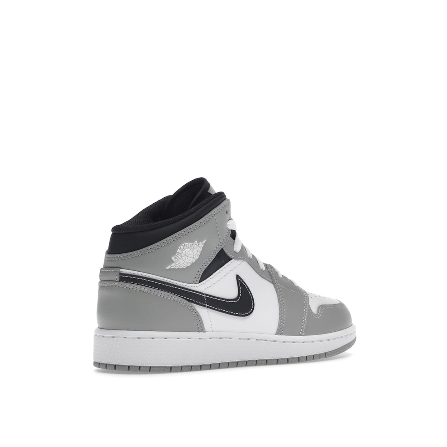 Jordan 1 Mid sneakers (GS), back view, model 554725-078, in light smoke grey with black and white accents.