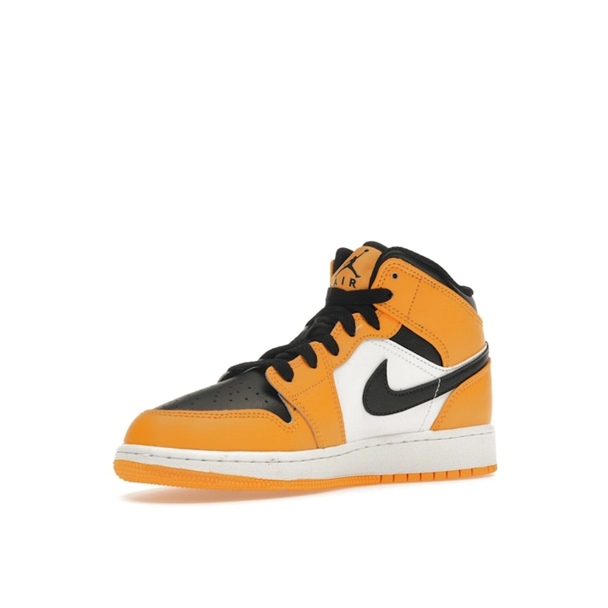 Jordan 1 Mid GS sneakers, front view, in yellow and black with classic Jordan design.