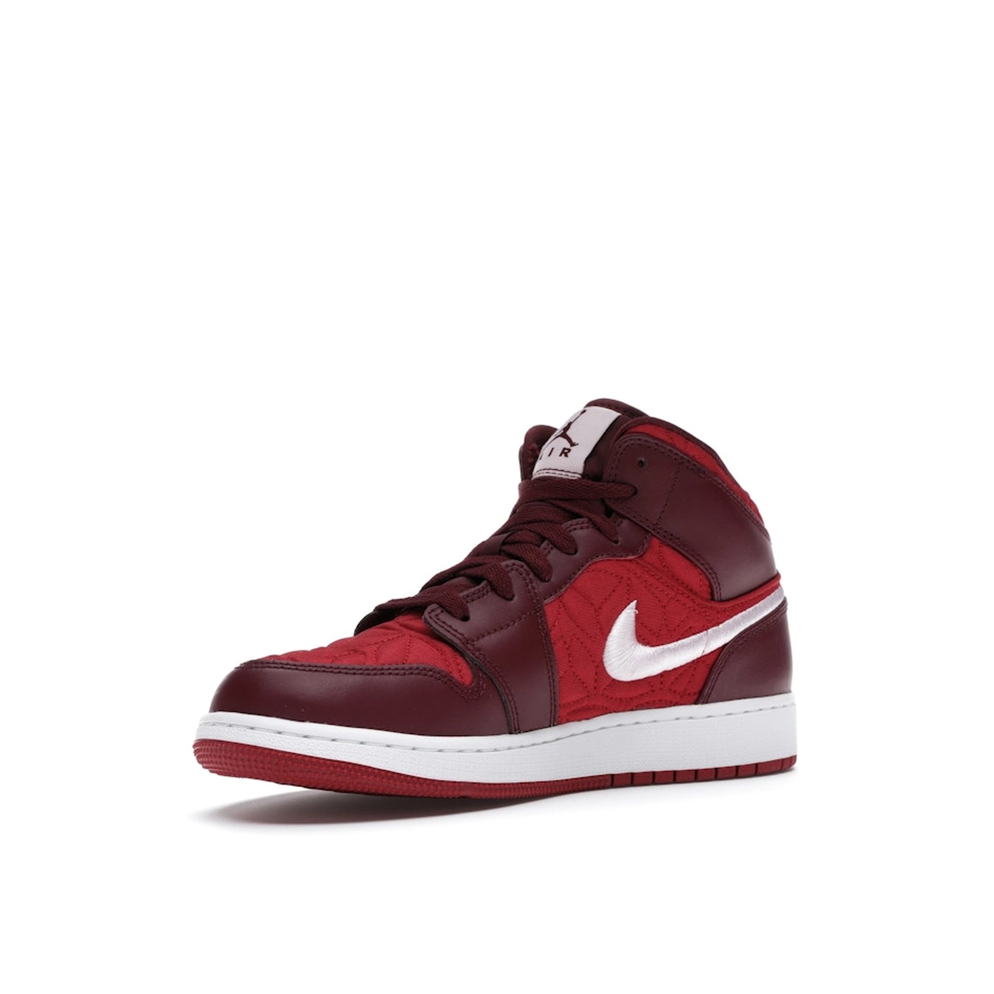 Jordan 1 Mid SE Red Quilt GS sneakers, front view, in red with quilted details.